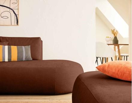 Canapé modulable d'angle gauche 4 places avec pouf en tissu texturé Santorini