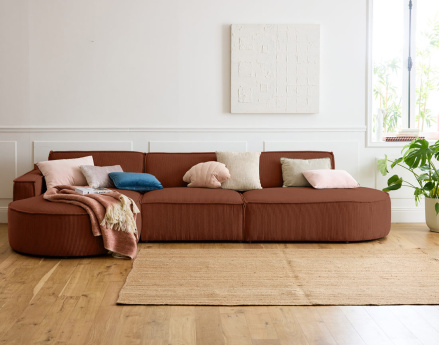 Canapé d'angle gauche aux formes arrondies 5 places en velours côtelé Spiaggia