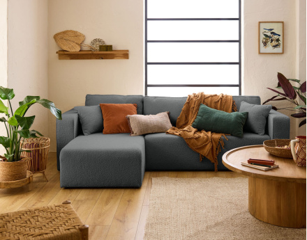 Canapé d'angle 4 places convertible avec coffre en tissu bouclette Topaze