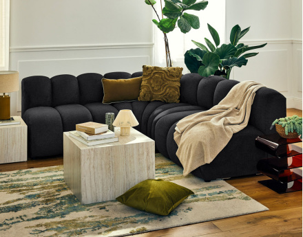 Canapé modulable d'angle réversible 4 places sans accoudoirs en tissu texturé Debbie