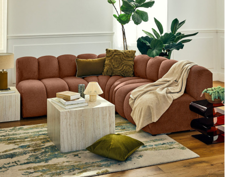 Canapé modulable d'angle réversible 4 places sans accoudoirs en tissu texturé Debbie