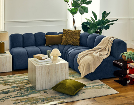 Canapé modulable d'angle réversible 4 places sans accoudoirs en tissu texturé Debbie